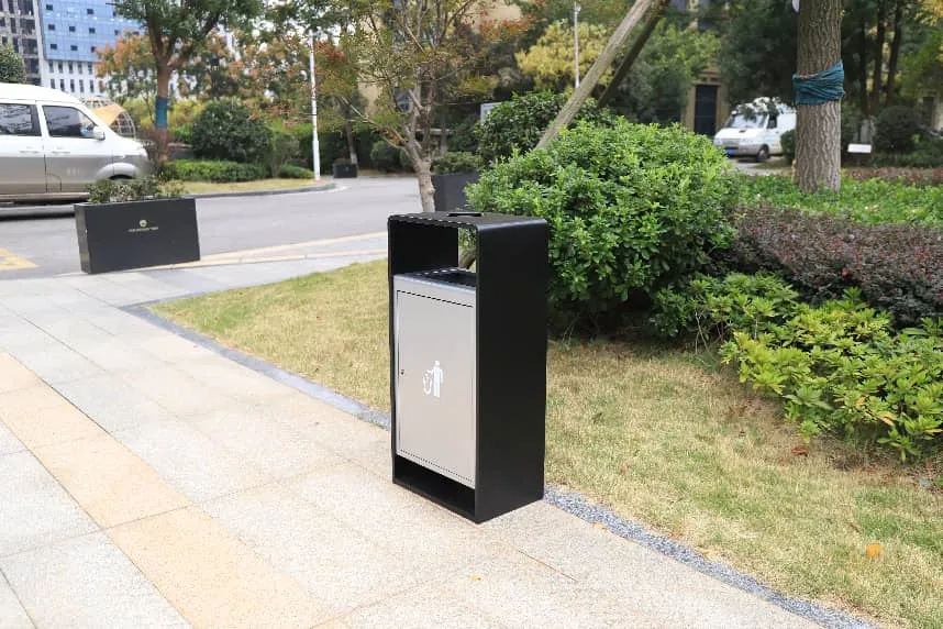 commercial garbage bin on city sidewalk