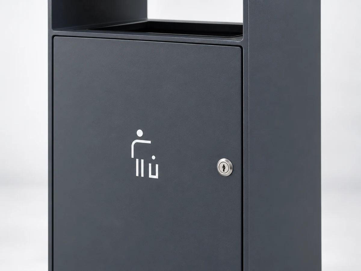 Close-up of the silver key lock on the OTB-04 dark gray front service door